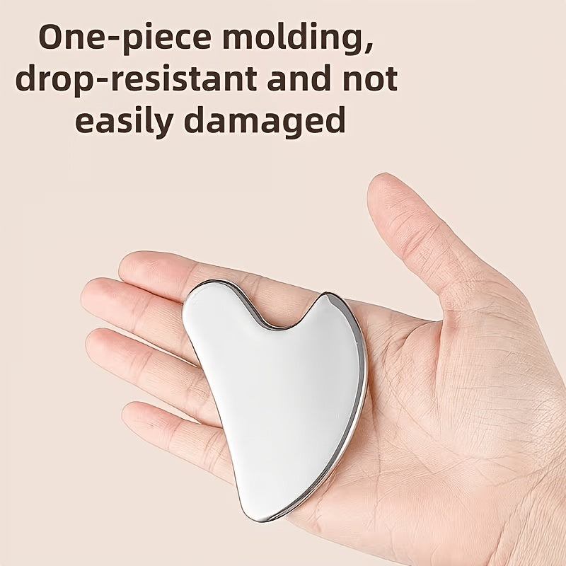 One-piece stainless steel gua sha in the hand